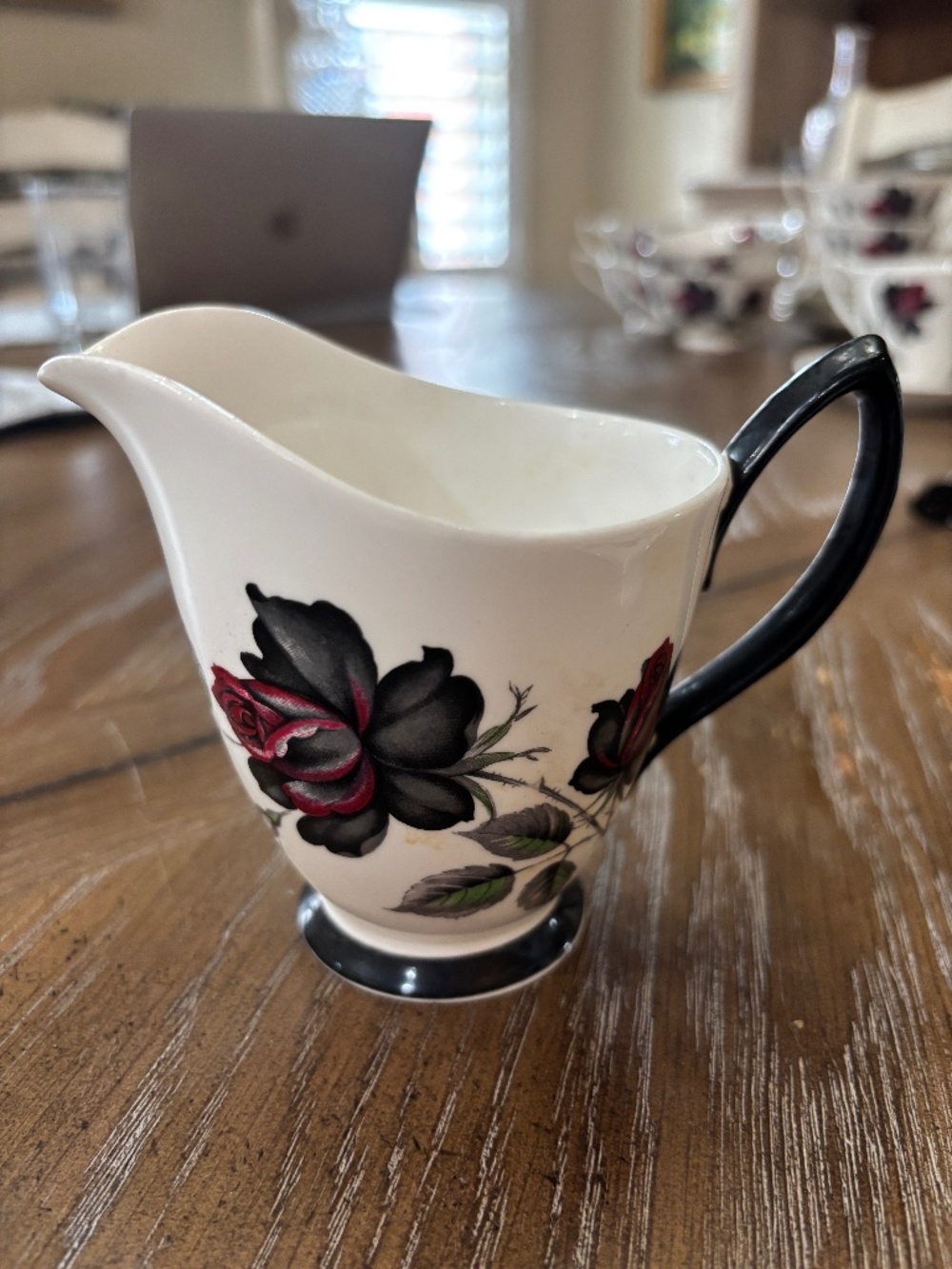 Royal Albert Masquerade Creamer with black handle and foot